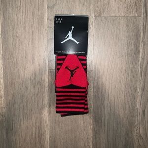 Brand new black and red Jordan socks. Mens size large. 8-12 shoe size.